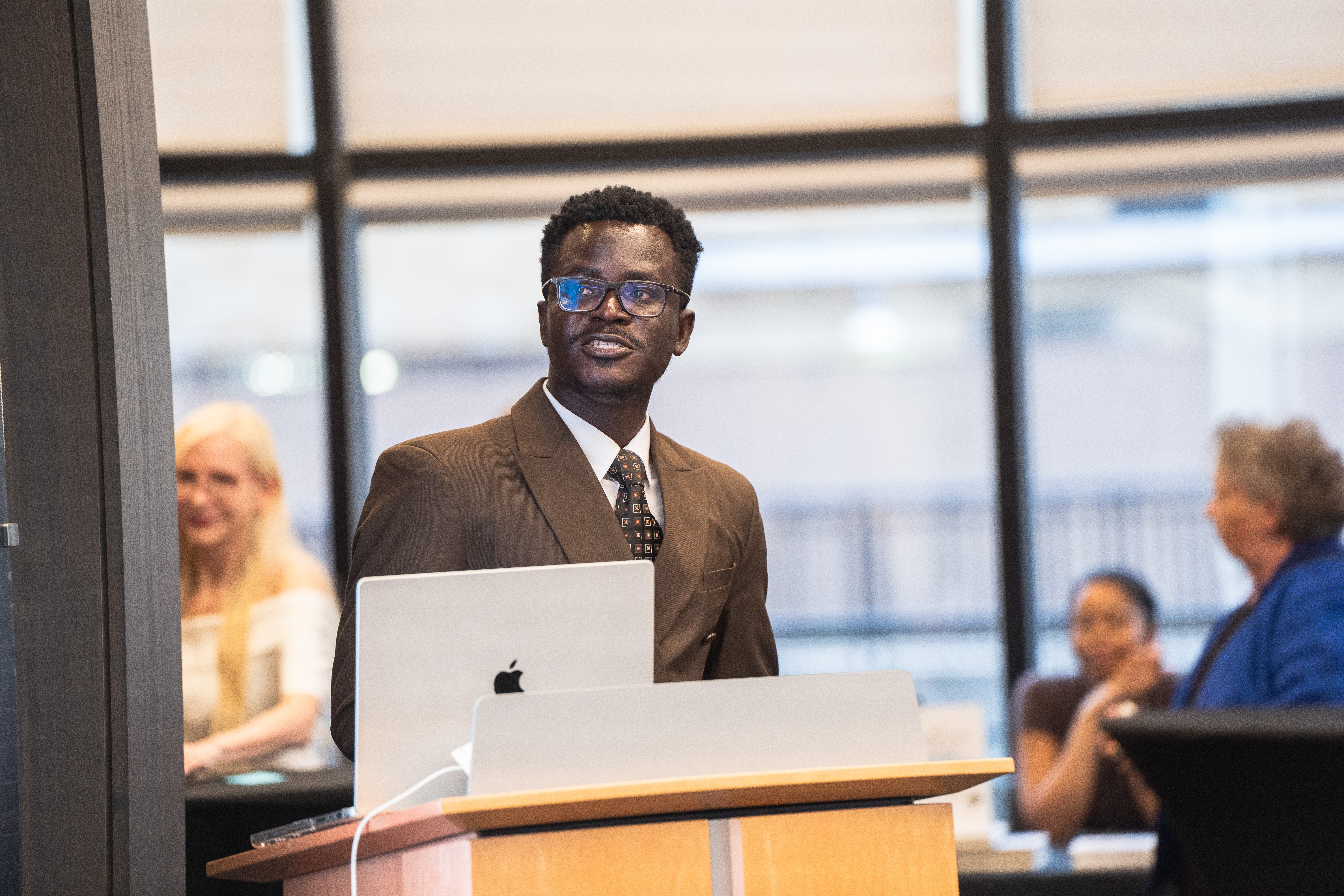 James Arthur at the lectern presenting his Health Justice Scholars entry.