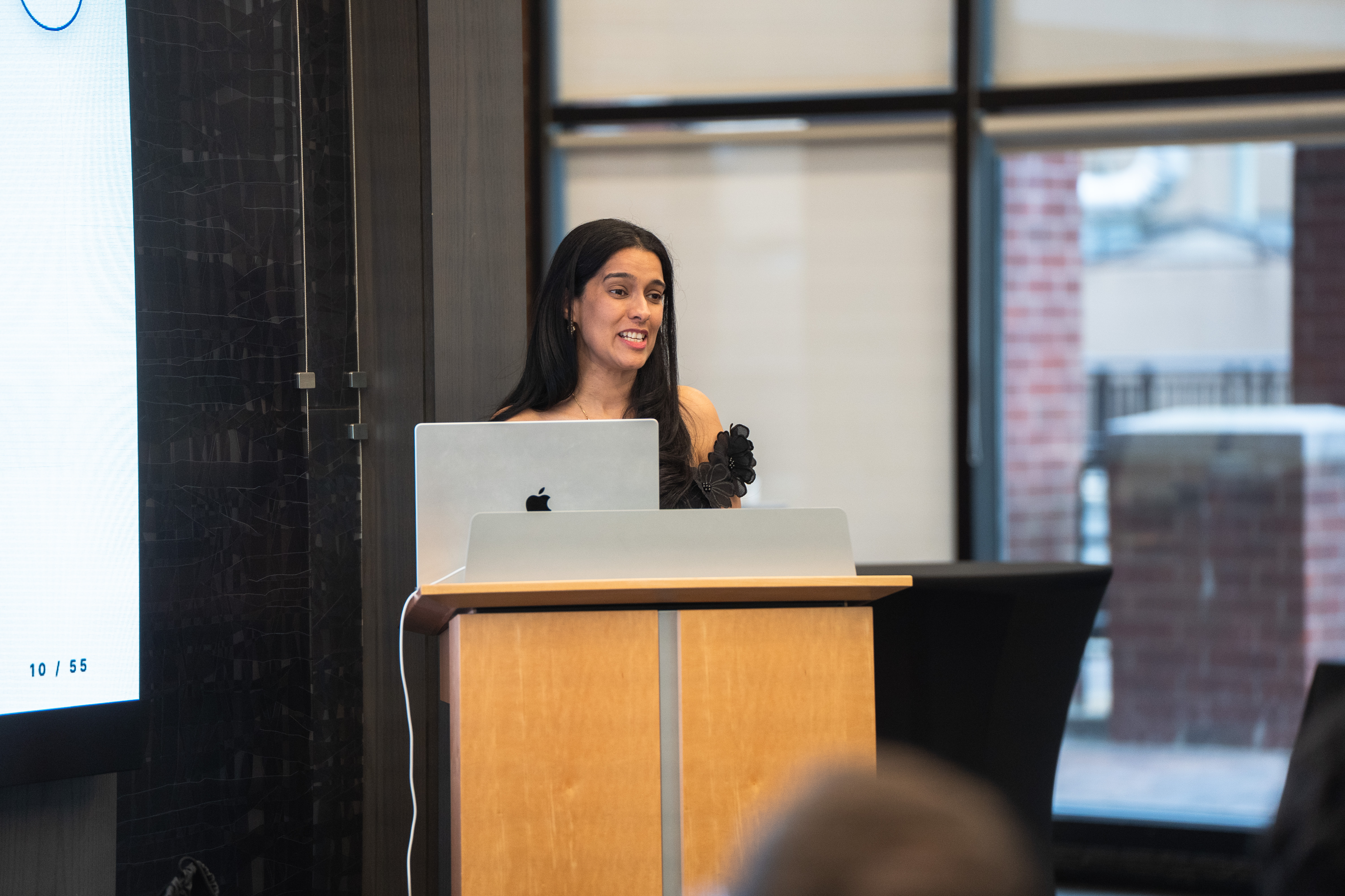 Dr. Kadambari Rawal at the lectern delivering her featured-speaker remarks.